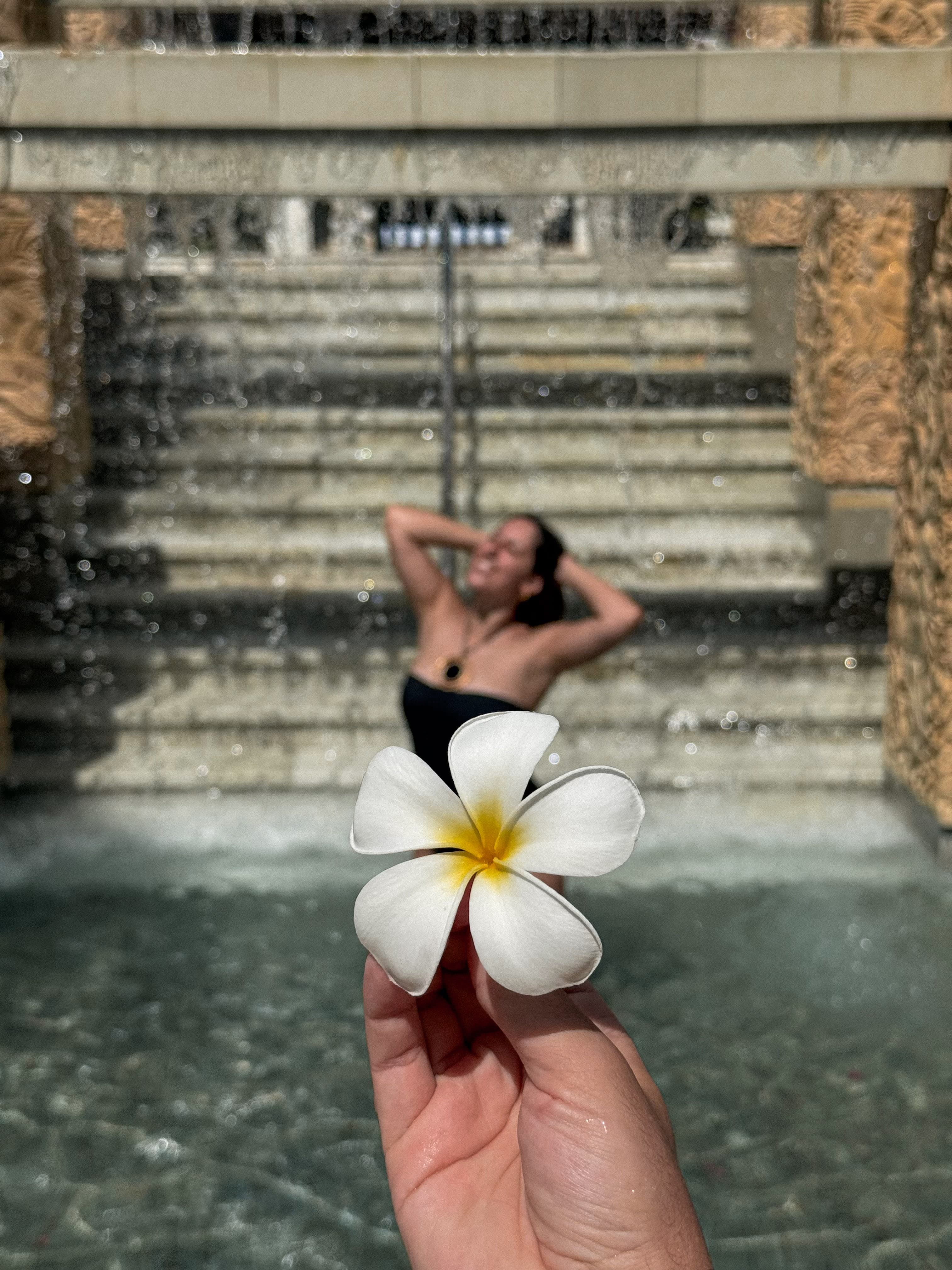 Luxury bathroom with natural flower arrangements - Instagram-worthy detail that generates 50K+ organic impressions
