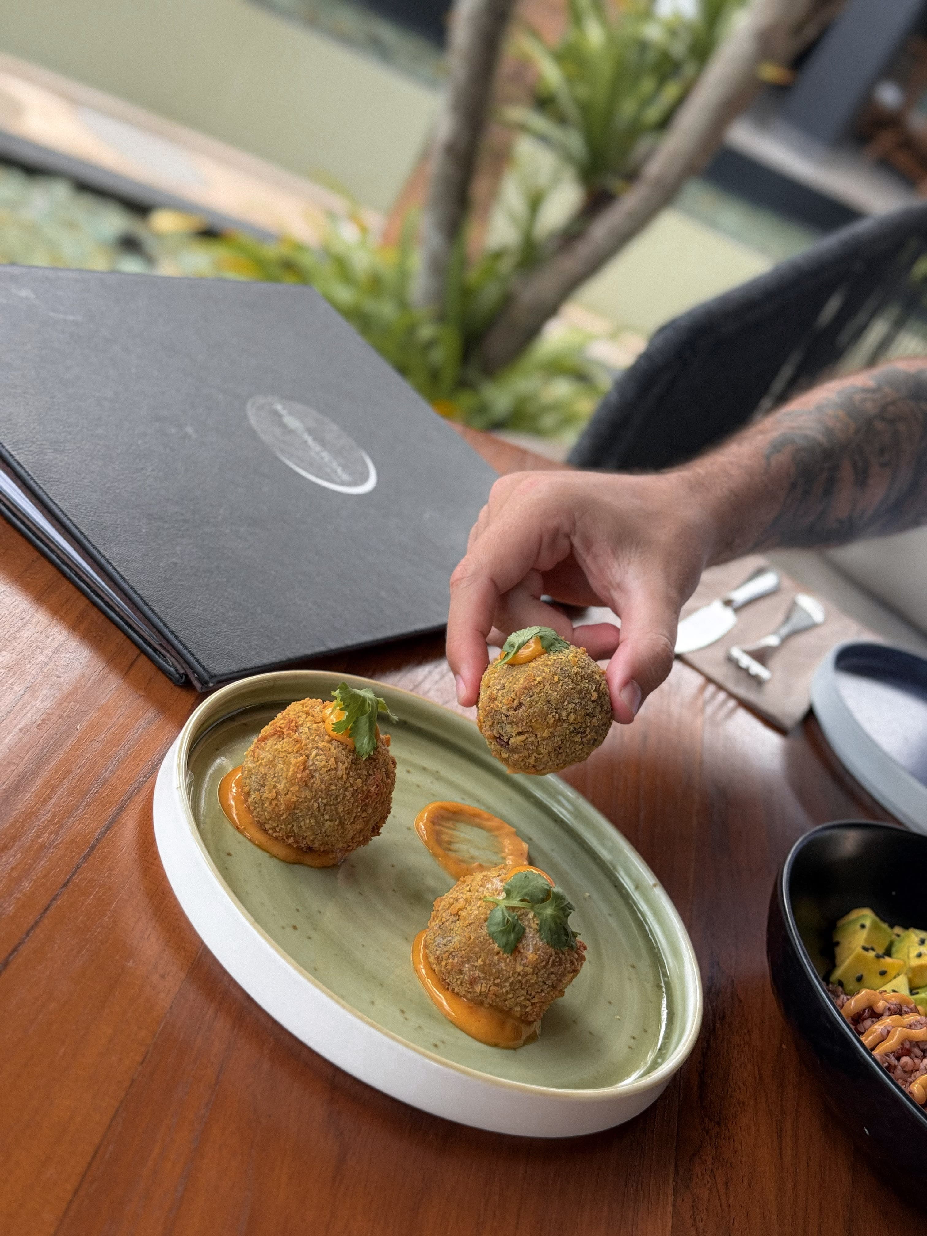 Gourmet arancini with artisanal presentation - premium appetizer that increases average order value by $15